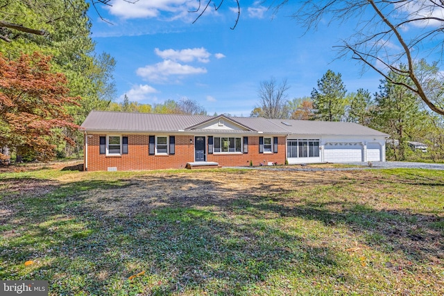2475 W Denneys Rd, Dover, DE 19904 - ranch-style house with an attached garage, brick siding, a front yard, and metal roof