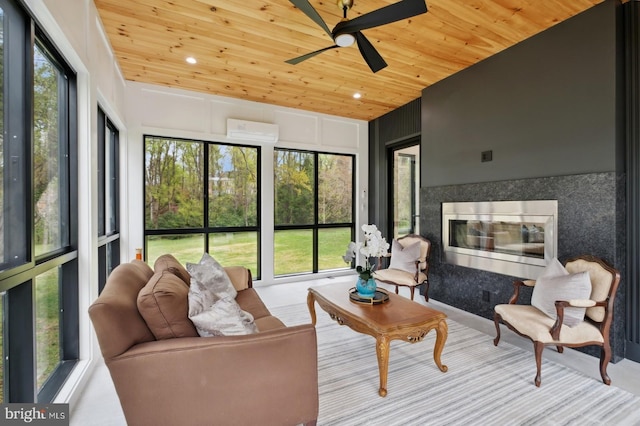 sunroom featuring recessed lighting, a healthy amount of sunlight, a ceiling fan, and wooden ceiling