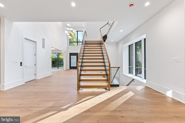 interior space with recessed lighting, wood finished floors, and plenty of natural light