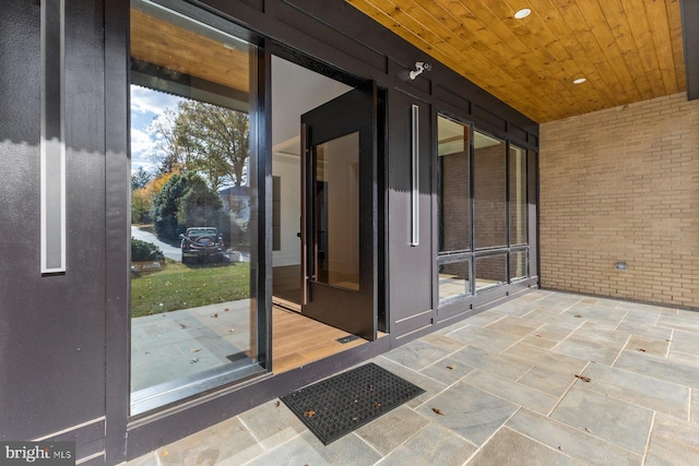 exterior space featuring brick siding