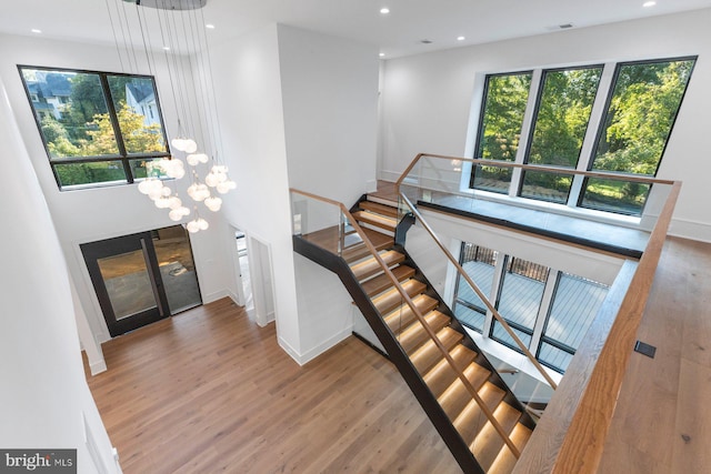 foyer entrance featuring recessed lighting, wood finished floors, and baseboards