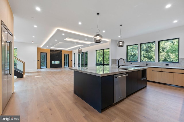 kitchen featuring modern cabinets, a spacious island, dishwasher, and recessed lighting