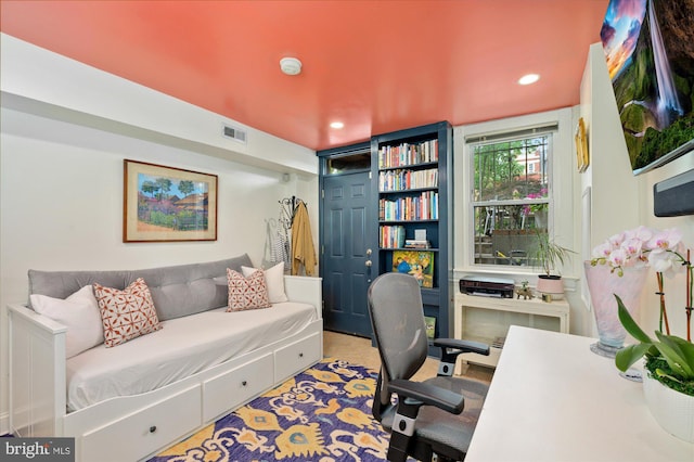 office space with visible vents, recessed lighting, and built in shelves