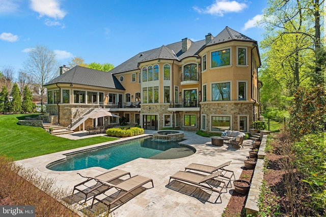 840 Childs Point Rd, Annapolis, MD 21401 - rear view of house featuring a lawn, a patio, a chimney, and stone siding