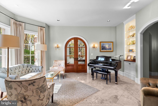 840 Childs Point Rd, Annapolis, MD 21401 - living area with french doors, arched walkways, built in shelves, baseboards, and recessed lighting