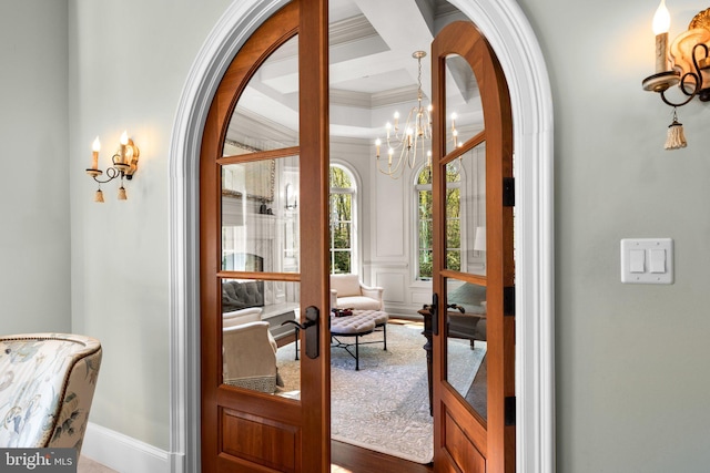 840 Childs Point Rd, Annapolis, MD 21401 - entryway featuring arched walkways, beamed ceiling, a chandelier, ornamental molding, and coffered ceiling