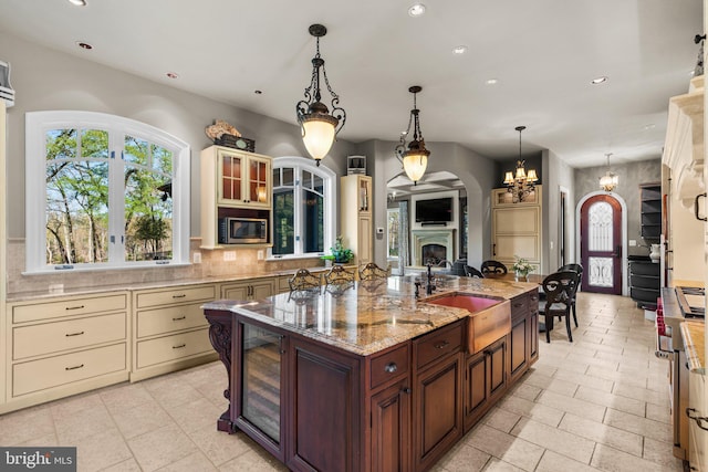 840 Childs Point Rd, Annapolis, MD 21401 - kitchen with cream cabinetry, stainless steel microwave, recessed lighting, and a sink