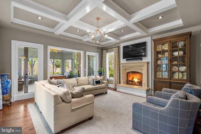 840 Childs Point Rd, Annapolis, MD 21401 - living room featuring a warm lit fireplace, coffered ceiling, a notable chandelier, and beamed ceiling