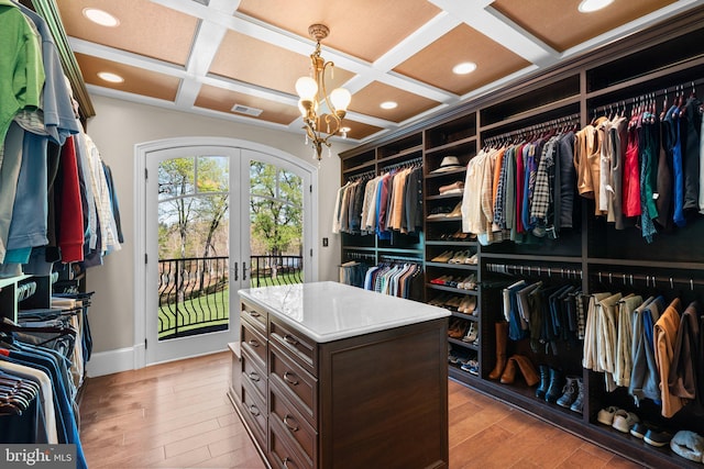 840 Childs Point Rd, Annapolis, MD 21401 - walk in closet featuring french doors, visible vents, light wood-type flooring, a notable chandelier, and coffered ceiling