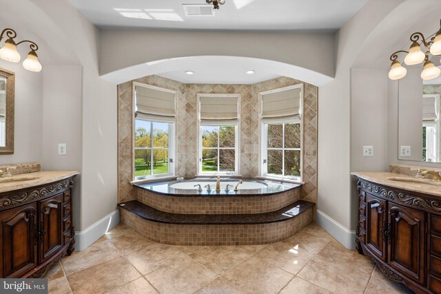 840 Childs Point Rd, Annapolis, MD 21401 - bathroom featuring baseboards, visible vents, two vanities, and a sink
