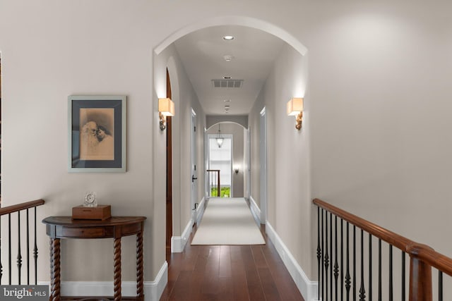 840 Childs Point Rd, Annapolis, MD 21401 - corridor with arched walkways, baseboards, visible vents, and wood finished floors