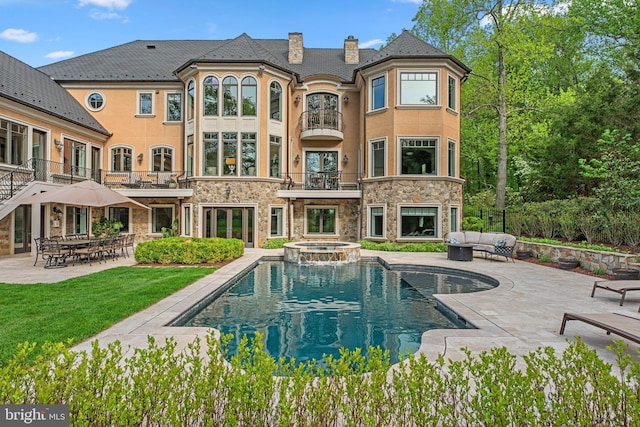 840 Childs Point Rd, Annapolis, MD 21401 - back of house with a chimney, an outdoor hangout area, a patio area, and a balcony