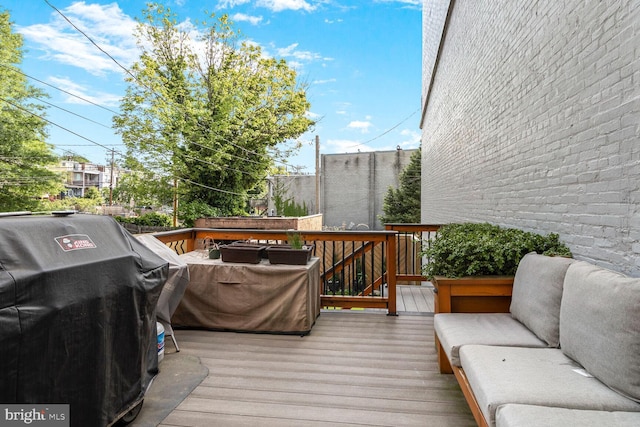 2103 Bolton St, Baltimore, MD 21217 - wooden deck featuring an outdoor living space and a grill