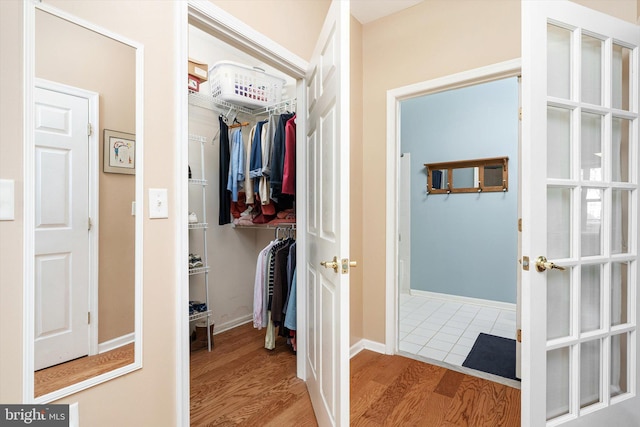 interior space featuring wood finished floors and baseboards