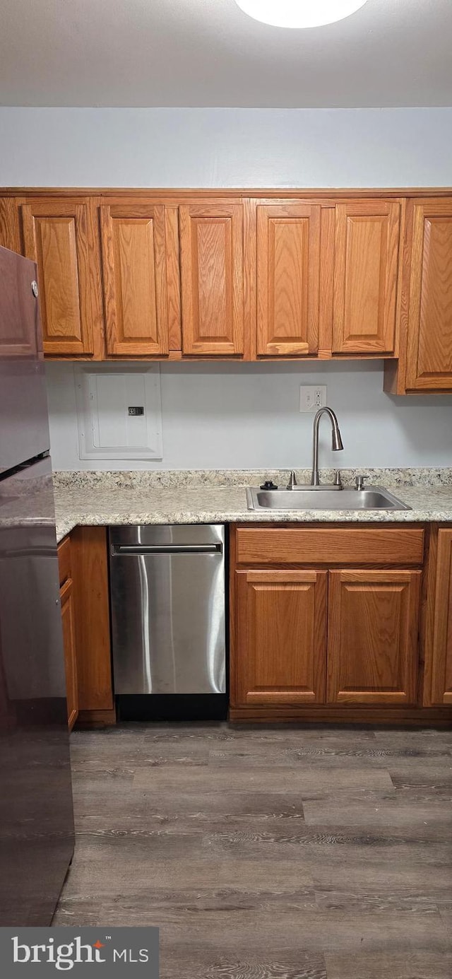 3811 Swann Rd Unit T-1, Suitland, MD 20746 - kitchen with a sink, brown cabinetry, wood finished floors, and dishwasher
