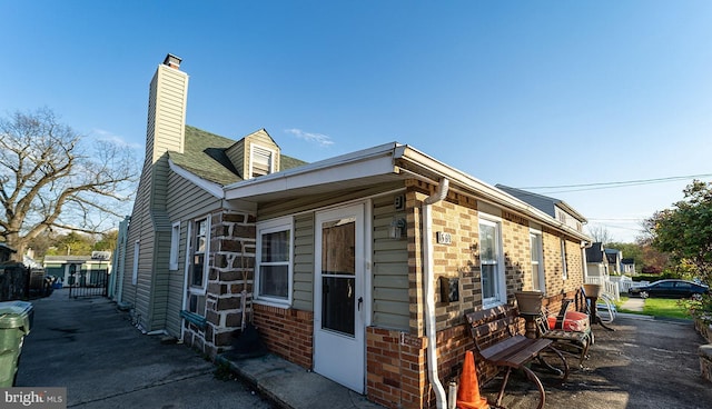 1569 Prospect Ave, Willow Grove, PA 19090 - view of property exterior featuring brick siding and a chimney