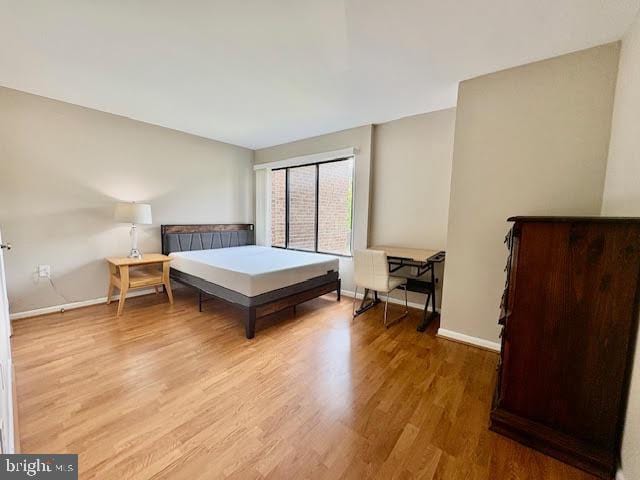 15702 Dorset Rd Unit 204, Laurel, MD 20707 - bedroom with wood finished floors and baseboards