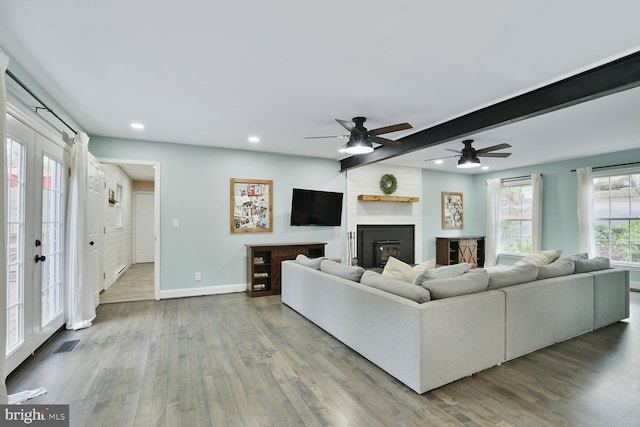 living room with recessed lighting, wood finished floors, and baseboards