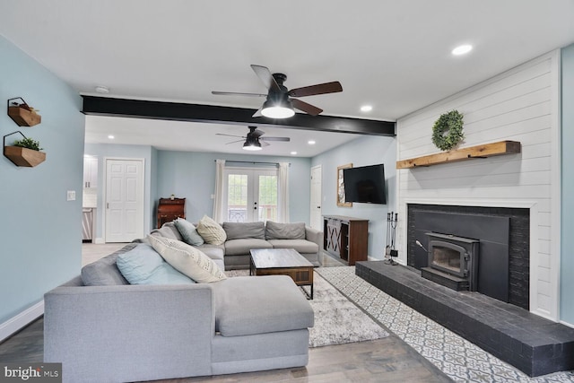 living area with recessed lighting, wood finished floors, french doors, baseboards, and ceiling fan