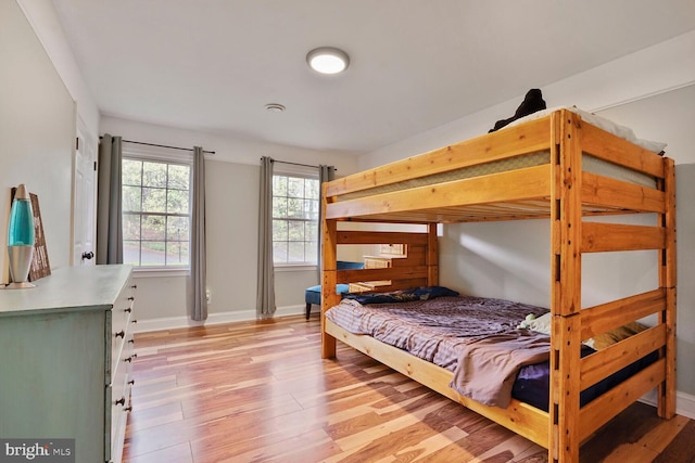 bedroom with baseboards and light wood-style floors