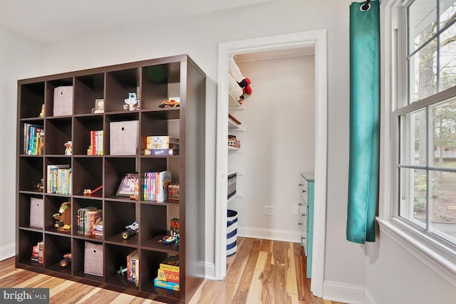 interior space featuring wood finished floors and baseboards