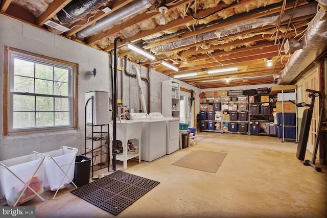 basement featuring a sink and independent washer and dryer