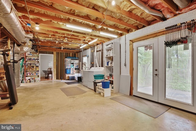 basement with separate washer and dryer and french doors