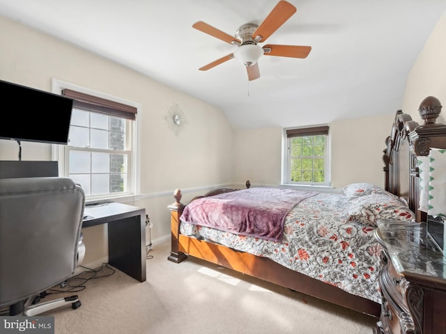 carpeted bedroom featuring baseboards, ceiling fan, and lofted ceiling