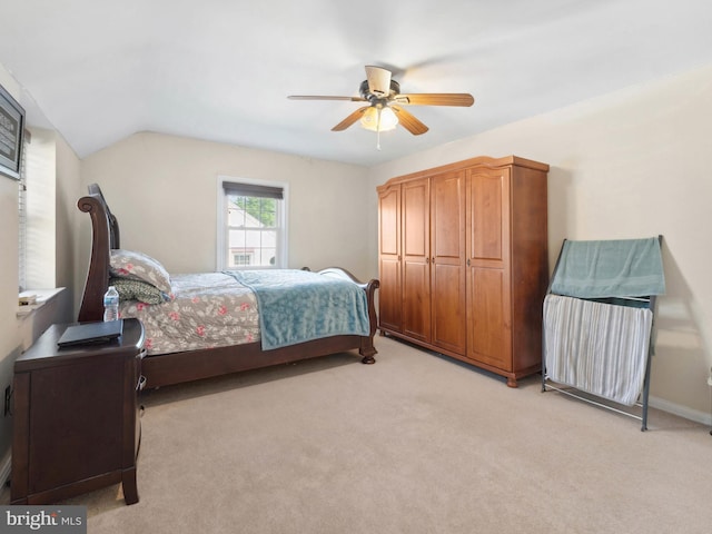 bedroom with light carpet and a ceiling fan