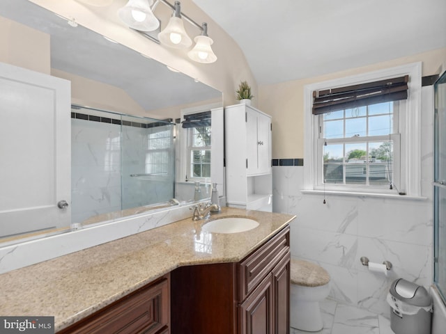 full bathroom with vanity, toilet, marble finish floor, lofted ceiling, and an enclosed shower