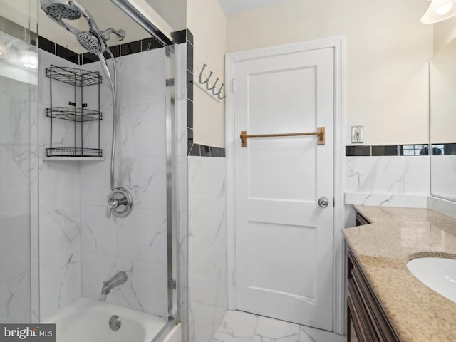 full bath with vanity, marble finish floor, and shower / bathing tub combination