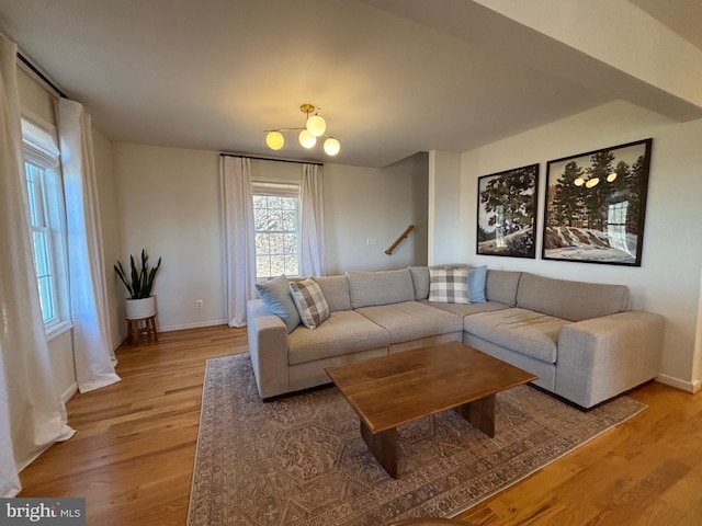 living room featuring baseboards and wood finished floors