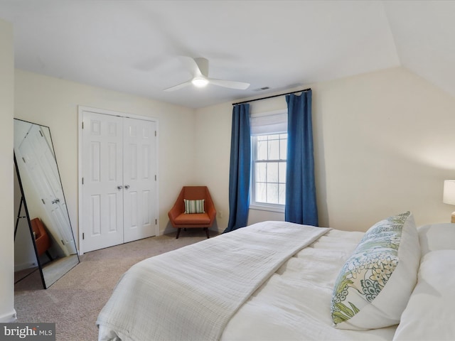 carpeted bedroom featuring a closet and a ceiling fan