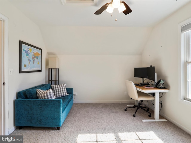 office area with vaulted ceiling, carpet flooring, baseboards, and a ceiling fan