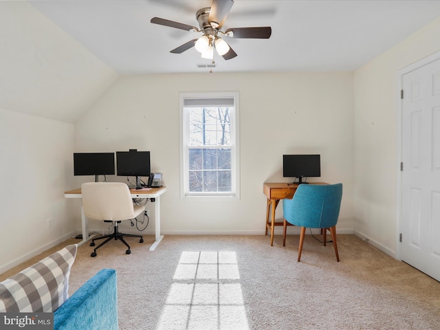 home office featuring vaulted ceiling, a ceiling fan, carpet floors, baseboards, and visible vents