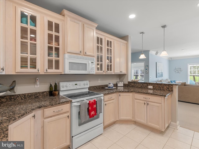kitchen featuring light tile patterned floors, white appliances, a peninsula, glass insert cabinets, and open floor plan