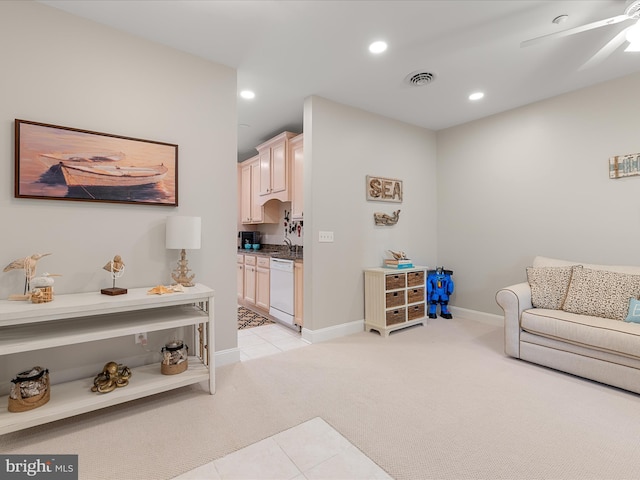 living area featuring recessed lighting, visible vents, light carpet, baseboards, and ceiling fan