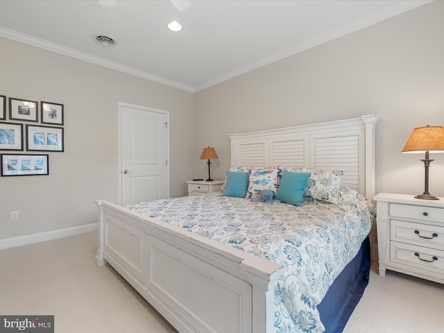 bedroom with baseboards, visible vents, crown molding, and light colored carpet