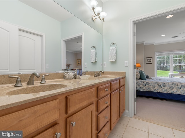 ensuite bathroom with ensuite bath, ornamental molding, tile patterned flooring, and a sink