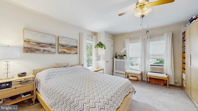 bedroom featuring light carpet and ceiling fan