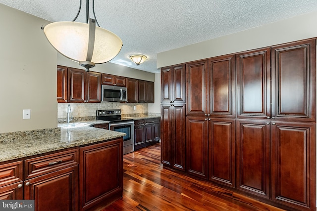 510 Chanticleer, Cherry Hill, NJ 08003 - kitchen featuring appliances with stainless steel finishes, a textured ceiling, dark wood-style flooring, tasteful backsplash, and a sink
