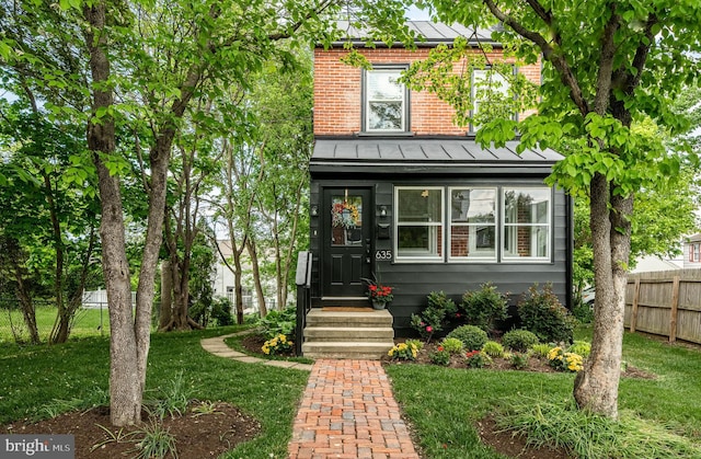 american foursquare style home with solar panels and brick siding