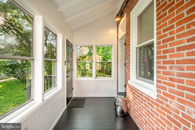 unfurnished sunroom with healthy amount of natural light and hardwood / wood-style flooring