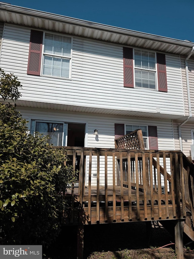 back of property featuring a deck
