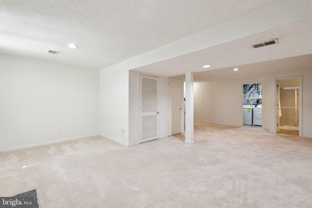 14724 Flower Hill Dr, Centreville, VA 20120 - finished below grade area featuring washing machine and dryer, light carpet, visible vents, and recessed lighting