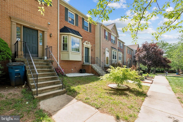 14724 Flower Hill Dr, Centreville, VA 20120 - view of front facade with brick siding and a residential view
