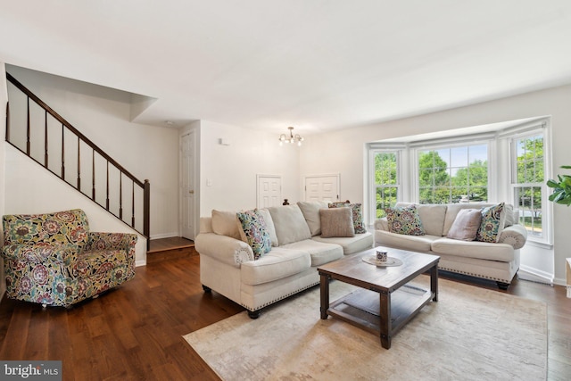 14724 Flower Hill Dr, Centreville, VA 20120 - living room featuring stairway, an inviting chandelier, baseboards, and wood finished floors