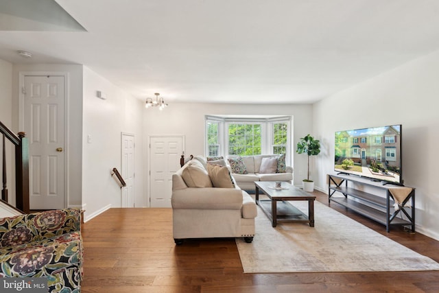14724 Flower Hill Dr, Centreville, VA 20120 - living area featuring an inviting chandelier, baseboards, and dark wood-style floors