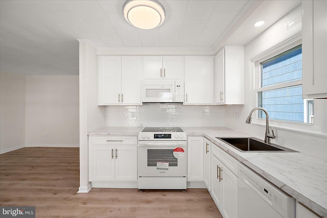 12505 Assawoman Dr, Ocean City, MD 21842 - kitchen with decorative backsplash, a sink, white appliances, and white cabinets
