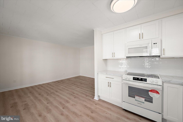 12505 Assawoman Dr, Ocean City, MD 21842 - kitchen featuring decorative backsplash, white appliances, light wood-type flooring, white cabinets, and baseboards